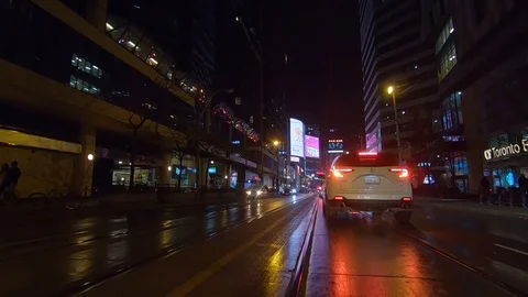 Driving plate POV low angle Toronto dark city streets at night downtown urban Stock Footage 122031996