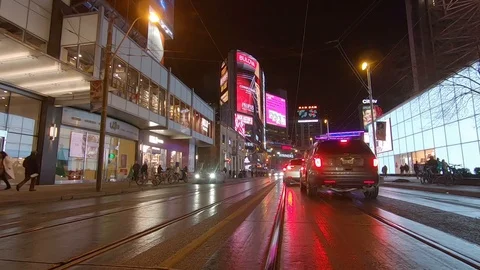 Driving plate POV low angle Toronto dark city streets at night downtown urban Stock Footage 122032222