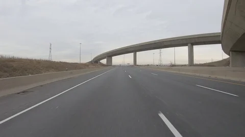 Driving plate POV reverse angle on highway with trucks cars and tractor trailers Stock Footage 100120029