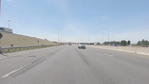Driving plate reverse highway driving with tractor trailer trucks and cars Stock Footage 108241646
