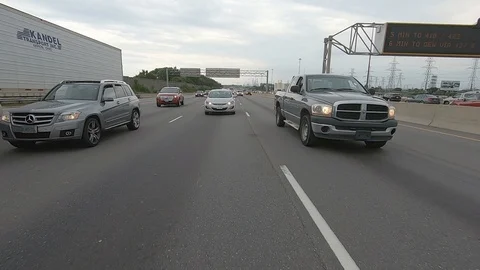 Driving plate reverse POV highway driving with cars and trucks traffic Stock Footage 112912508