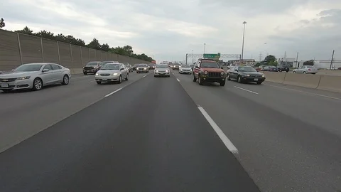 Driving plate reverse POV highway driving with cars and trucks traffic Stock Footage 112912814