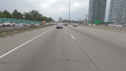 Driving plate reverse POV highway driving with cars and trucks traffic Stock Footage 112916529