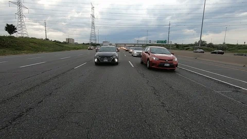 Driving plate reverse POV highway driving with cars and trucks traffic Stock Footage 112918809