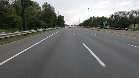 Driving plate reverse POV highway driving with cars and trucks traffic Stock Footage 112920963