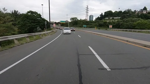 Driving plate reverse POV highway driving with cars and trucks traffic Stock Footage 112922358