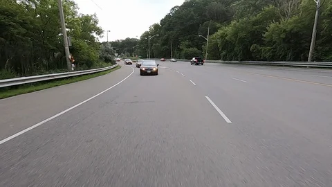 Driving plate reverse POV highway driving with cars and trucks traffic Stock Footage 112922641