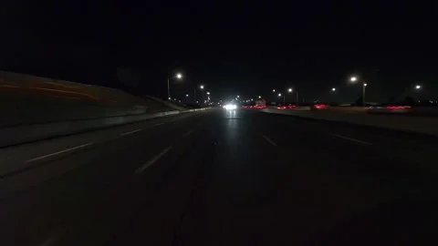 Driving plate of reverse rear view shot roads and highways on a very dark night 库存影片 155871308