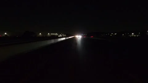 Driving plate of reverse rear view shot roads and highways on a very dark night Stock Footage 155871341