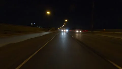 Driving plate of reverse rear view shot roads and highways on a very dark night Stock Footage 155871616