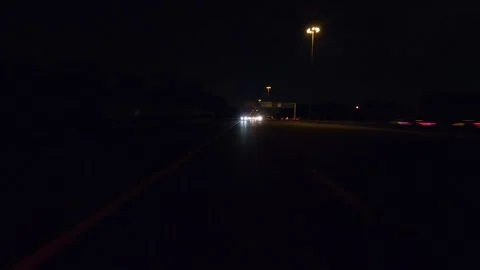 Driving plate of reverse rear view shot roads and highways on a very dark night Stock Footage 155871743