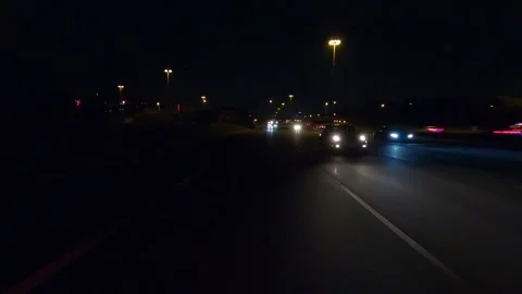 Driving plate of reverse rear view shot roads and highways on a very dark night 库存影片 155871752