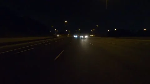 Driving plate of reverse rear view shot roads and highways on a very dark night 스톡 동영상 155871775