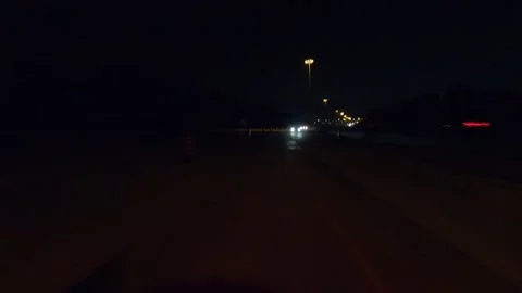 Driving plate of reverse rear view shot roads and highways on a very dark night 库存影片 155871784