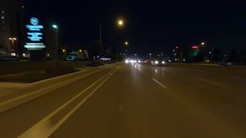 Driving plate of reverse rear view shot roads and highways on a very dark night Stock Footage 155872049