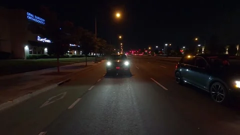 Driving plate of reverse rear view shot roads and highways on a very dark night 库存影片 155872117
