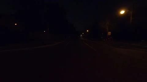 Driving plate of reverse shot roads and highways on a very dark night Stock Footage 155872390
