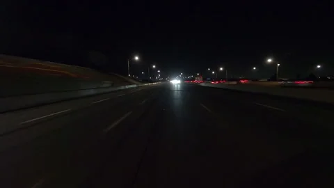 Driving plate of reverse shot roads and highways on a very dark night Stock Footage 155889027