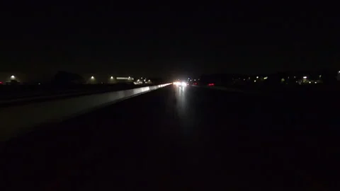 Driving plate of reverse shot roads and highways on a very dark night Stockbeeldmateriaal 155889839