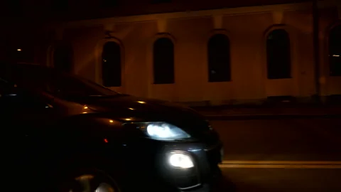 Driving plate side Left, car moves at the night street with car traffic. Stock Footage 99652928