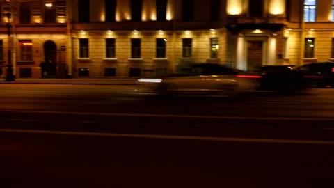 Driving plate side Left, car moves at the night street with car traffic Stock Footage 99653246