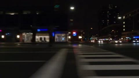 Driving plate with side view on dark city streets at night with buildings Stock-Footage 149796849