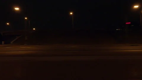 Driving plate with side view on dark city streets at night with buildings Video stock 149807931