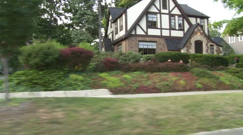 Driving plate, side view, day: upper middle class neighborhood H Stock Footage 40687943