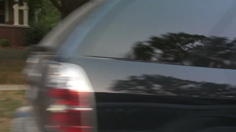 Driving plate, side view, day: middle class neighborhood R Stock Footage 40688357