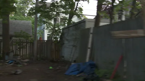 Driving plate, side view, day: middle class neighborhood N Stock Footage 40688491