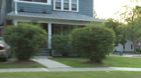 Driving plate, side view, day: middle class neighborhood L Video stock 40688592