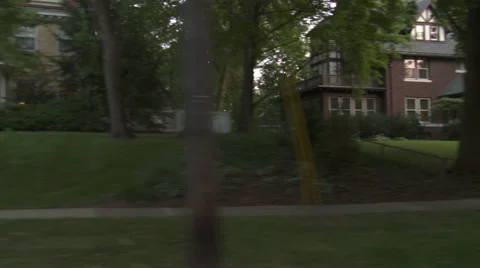 Driving plate, side view, day: middle class neighborhood Stock Footage 40688641