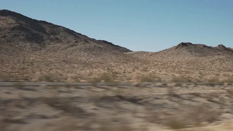 Driving plate side view of mountains from moving car Stock Footage 83246028