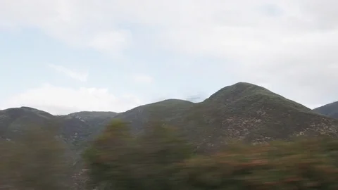 Driving plate side view of mountains near merced river from moving car Stock Footage 83247720