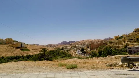 Driving Plate Side View Moving Through a small town In Car (Petra Jordan) Stock Footage 103217549