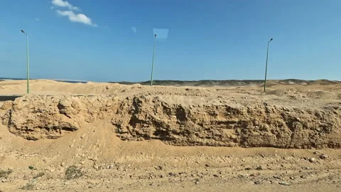 Driving plate side view moving through desert in car 스톡 동영상 229892882