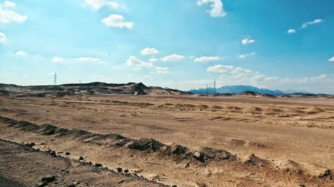 Driving plate side view moving through desert in car empty road. Video stock 231996087