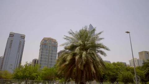 Driving plate side view with a view of The Landmark Abu Dhabi Stock Footage 104963737