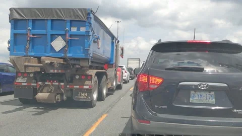 Driving plate stuck in slow moving rush hour traffic gridlock on highway 動画素材 156061355