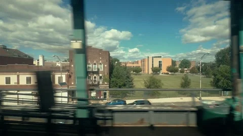"Driving Plate" (train window):  An express train passes through an urban area Stock Footage 161912950