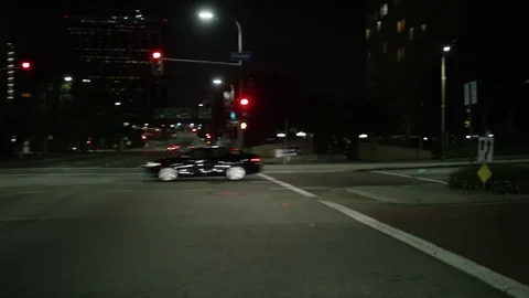 Driving plates through downtown Los Angeles at night Stock Footage 83057618