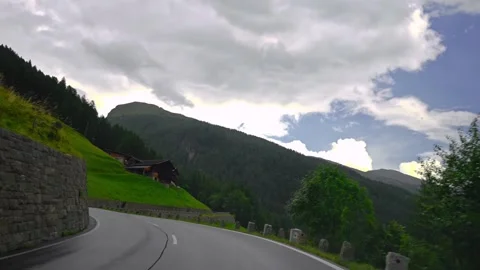 Driving point of view shot along a winding mountain road Stock Footage 346250339