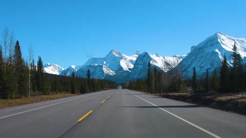 Driving POV on Icefields Parkway Toward Snow Capped Canadian Rockies Stock Footage 337251475