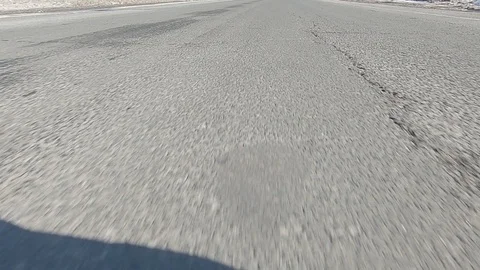 Driving POV low angle fast to the pavement on highway with traffic Stock Footage 103071137
