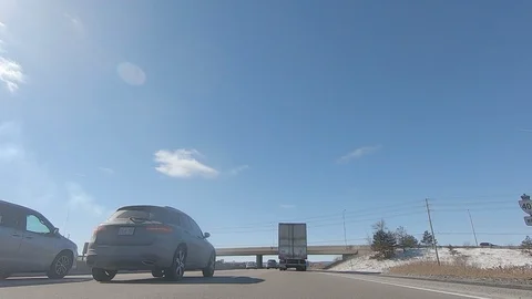 Driving POV low angle fast to the pavement on highway with traffic Stock Footage 103093783