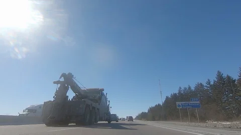 Driving POV low angle fast to the pavement on highway with traffic Stock Footage 103097370