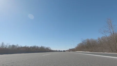 Driving POV low angle fast to the pavement on highway with traffic Stock Footage 103098620
