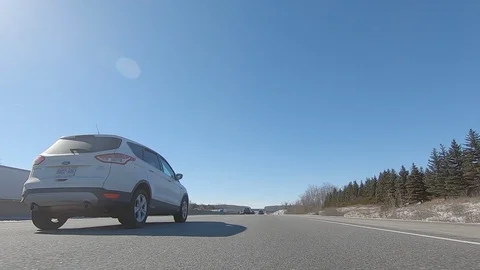 Driving POV low angle fast to the pavement on highway with traffic Stock Footage 103098892