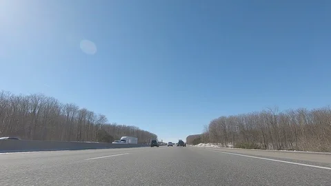 Driving POV low angle fast to the pavement on highway with traffic Stock Footage 103099093