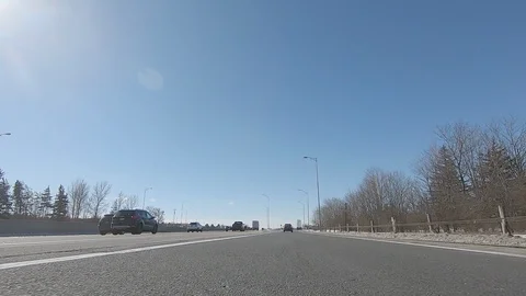 Driving POV low angle fast to the pavement on highway with traffic Stock Footage 103099241